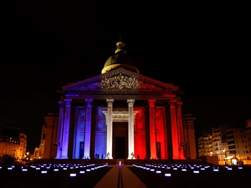The colours of the French flag are projected on the facade of the Pantheon mausoleum during a national tribute for Late French writer Maurice Genevoix and 'Men of 14' as part of Armistice Day commemorations marking the end of World War I, on November 11, 2020, in Paris, as part of the commemorations marking the 102nd anniversary of the November 11, 1918 Armistice, ending World War I (WWI). CHRISTIAN HARTMANN / POOL / AFP