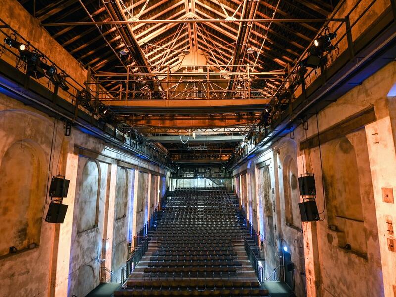 A picture taken on November 20, 2020 shows empty seats at the Geblaesehalle theater at the Landschaftspark Duisburg-Nord in Duisburg, western Germany. The Geblaesehalle is part of the steam blower house, a building complex from the founding phase of the former steelworks of August Thyssen and owns 1000 seats. No public events will take place at theaters until December, 2020 to limit the spread of the novel coronavirus. Ina FASSBENDER / AFP