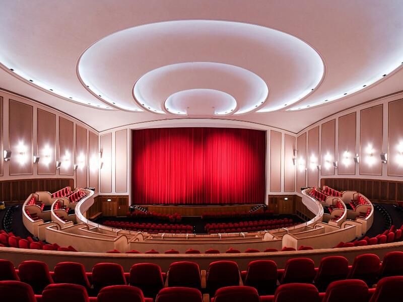 A picture taken on November 19, 2020 shows the closed red curtain at the Lichtburg cinema in Essen, western Germany. The Lichtburg, which was built 1928, is a historical cinema with 1250 seats and is the largest cinema hall in Germany. No public events will take place at theaters until December, 2020 to limit the spread of the novel coronavirus. Ina FASSBENDER / AFP