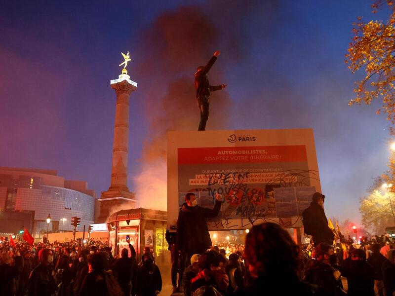 Demonstrators in Paris protest on Saturday France's "global security" draft law. Photo: Thomas Coex/AFP via Getty Images
