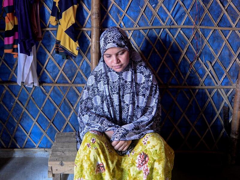 In this photograph taken on August 24, 2020, Rohingya refugee Somuda Begum pauses during an interview with AFP at Kutupalong refugee camp in Ukhia. Stay in a squalid refugee camp -- hopeless, starving, and made to feel a burden -- or leave, risking death, rape, human trafficking and months at sea to reach a husband you've never met. This is the bleak choice many Rohingya women, already scarred from fleeing persecution in Myanmar, are now facing. Munir UZ ZAMAN / AFP
