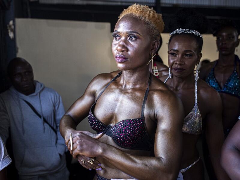 Bodybuilders wait before going on stage during the Iron Fit Bodybuilding competition in Nairobi on December 05, 2020. 130 participants from all across East Africa took part in the second edition of this competition which included categories like Bikini, Figure, Physique and Bodybuilding. Patrick Meinhardt / AFP