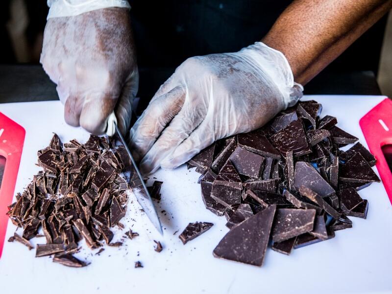 Preparation of a chocolate ganache with local rum by chocolate maker Ralph Leroy in the workshops of Makaya Chocolat on December 23, 2020 in Petionville, Haiti. Although small in the face of South America's giants, Haiti is slowly developing its cocoa industry to ensure better incomes for thousands of modest farmers and to end the stereotype of gastronomic art known as the domain of wealthy countries. Valerie Baeriswyl / AFP