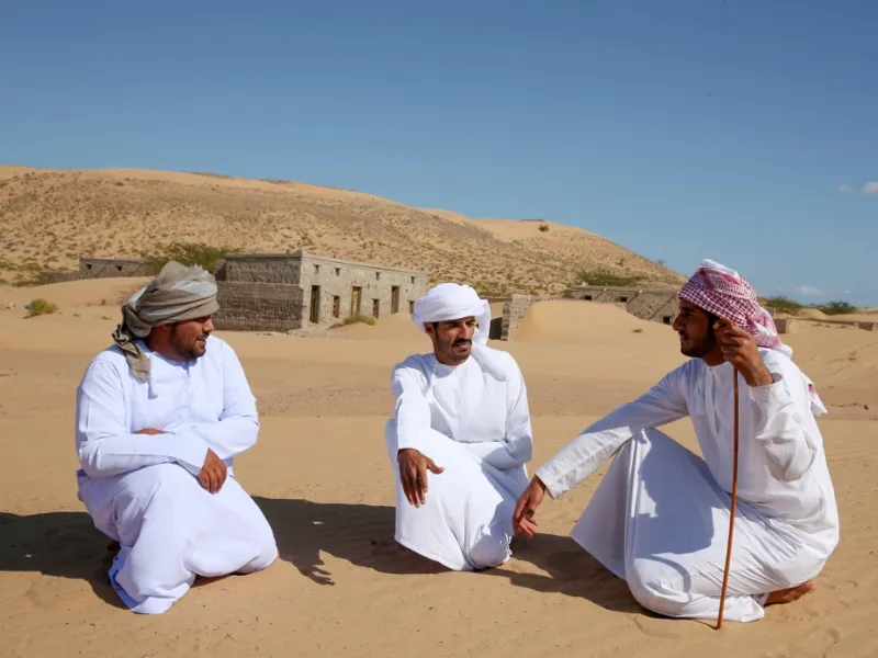 Former inhabitants of Wadi al-Murr, gather near abandoned houses in the Omani village, about 400 kms (250 miles) southwest of the capital Muscat, on December 31, 2020. MOHAMMED MAHJOUB / AFP
