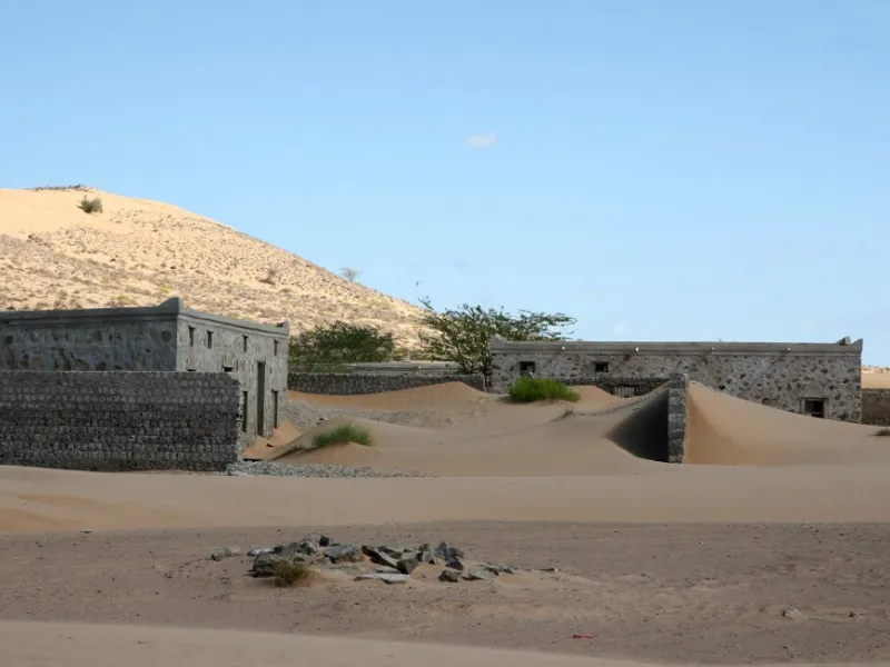 This picture taken on December 31, 2020, shows abandoned houses in the Omani village of Wadi al-Murr, about 400 kms (250 miles) southwest of the capital Muscat. MOHAMMED MAHJOUB / AFP