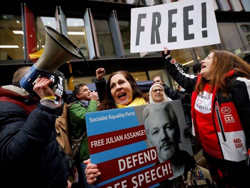 Supporters of Wikileaks founder Julian Assange celebrate outside the Old Bailey court in central London after a judge ruled that Assange should not be extradited to the United States to face espionage charges for publishing secret documents online on January 4, 2021. Tolga Akmen / AFP