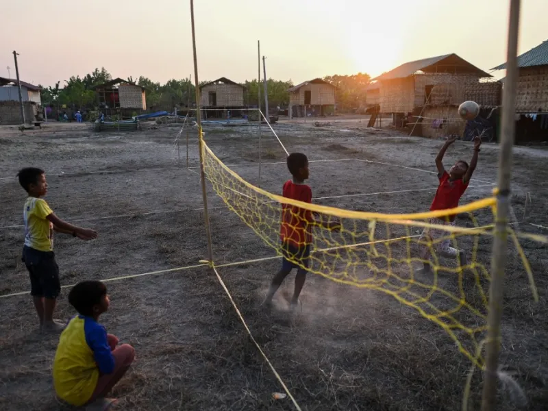 This photo taken on January 11, 2021 shows Chin children playing in Bethel village in Hmawbi, on the outskirts of Yangon, where hundreds of members of the Chin ethnic community have settled after being displaced by fighting between Myanmar's military and the Arakan Army in the country's north.  Ye Aung THU / AFP