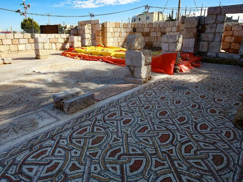 This picture shows the mosaic flooring of the Saint Mary church, built in 543 AD, the restoration of which was recently completed by workers employed by a pilot project run by the UN cultural agency UNESCO, in the small town of Rihab, some 70 kilometres north of the Jordanian capital Amman, on February 9, 2021. In the ruins of the ancient Byzantine church in Jordan, local townspeople and Syrian refugees work side by side on a project that unites preserving cultural heritage and fighting poverty.  Khalil MAZ
