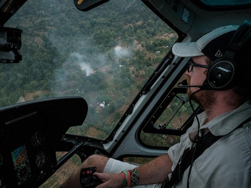 A picuture taken on February 8, 2021, shows a pilot following a swarm of desert locust during the surveillance flight as local farmers use fires to produce smoke to chase away locusts from their fields in Meru, Kenya. Yasuyoshi CHIBA / AFP