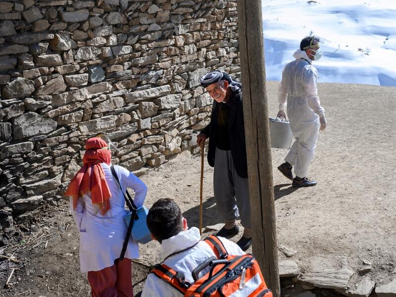 In this photograph taken on February 15, 2021, doctors and nurses from the Bahcesaray public hospital vaccination team, arrive at the village of Guneyyamac in eastern Turkey, as part of an expedition to vaccinate residents of 65 years old or above with Sinovac's CoronaVac Covid-19 vaccine. Turkey's population of more than 83 million is spread out across Europe and Asia and covers some seemingly impregnable terrain. The vaccination effort with China's CoronaVac jab kicked off with a bang in mid-January when 