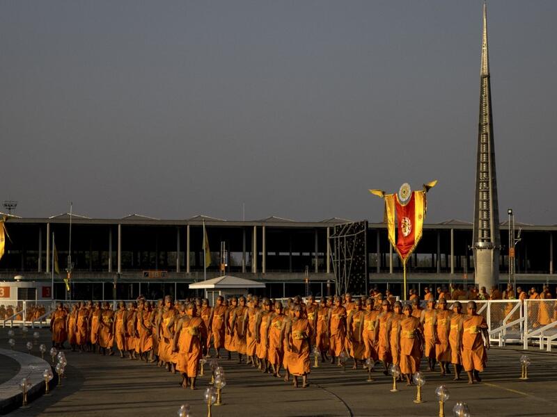 Buddhist monks arrive for Makha Bucha celebrations at Wat Dhammakaya, north of Bangkok on February 26, 2021. Jack TAYLOR / AFP
