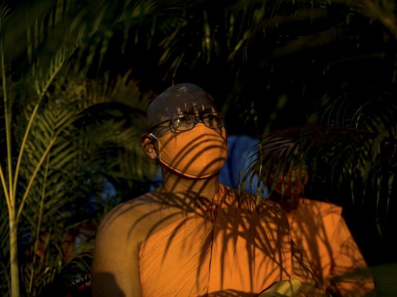 Buddhist monks prepare to take their place ahead of prayers during Makha Bucha celebrations at Wat Dhammakaya, north of Bangkok on February 26, 2021. Jack TAYLOR / AFP