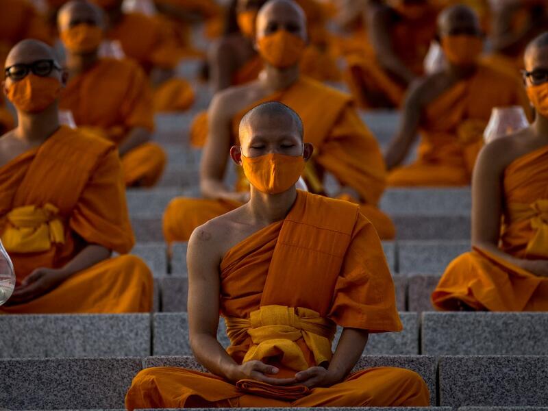 Buddhist monks attend the Makha Bucha celebrations at Wat Dhammakaya, north of Bangkok on February 26, 2021. Jack TAYLOR / AFP