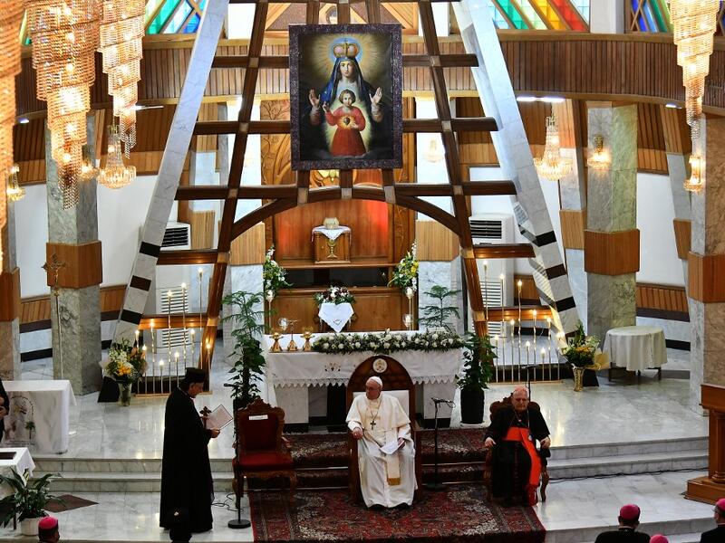 Pope Francis (C) visits Baghdad's Syriac Catholic Cathedral of Our Lady of Salvation 