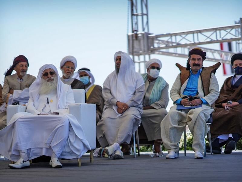 Chief of the Sabean Mandaean community, Sheikh Sattar Jabar Helou (L) and other dignitaries representing Iraq's religious