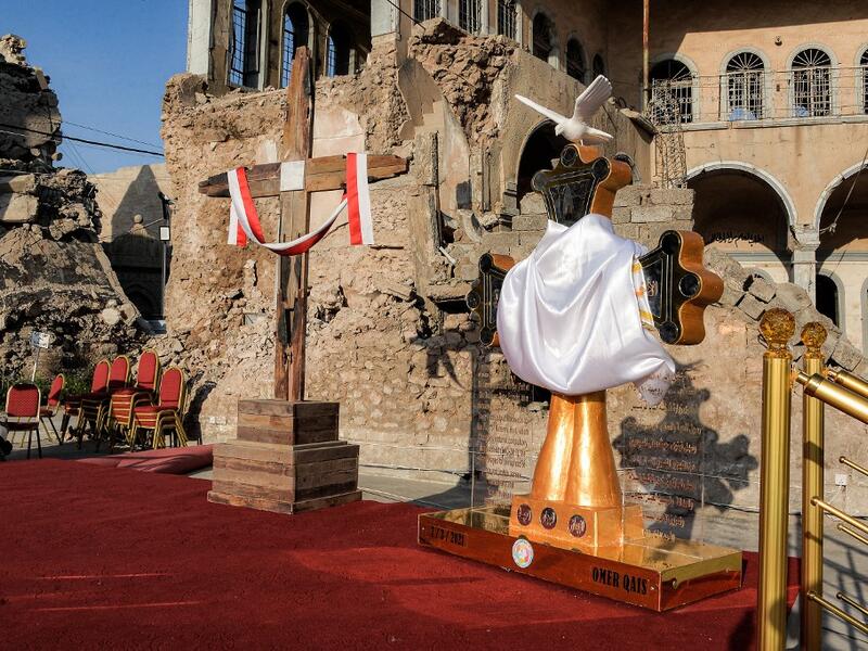  a view of (L to R) of Latin and Chaldean crosses placed upon a platform where Pope Francis is due to speak 
