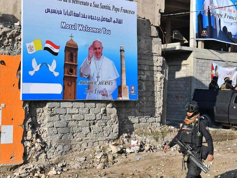 A member of the Iraqi security forces stands guard in the streets of the northern city of Mosul
