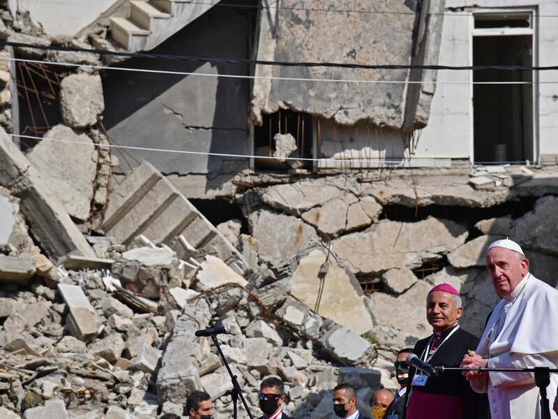 Pope Francis (R), accompanied by the Chaldean Catholic Archbishop of Mosul Najib Michaeel Moussa 