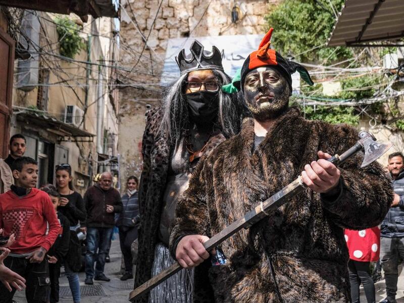 Carnival participants dressed in costume and wearing body paint 