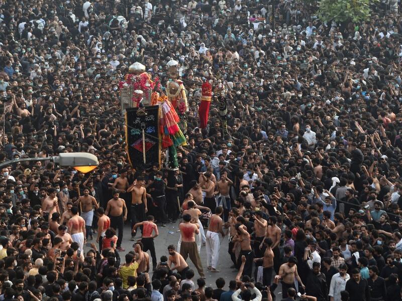 Shiite Muslim devotees take part in a procession to commemorate the death anniversary of Prophet Mohammad's companion and son-in-law Imam Ali in Lahore 