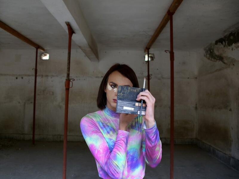 Albanian transgender Luana, puts her makeup on, in the former Communist-era maximum security prison for political prisoners in Spac, prior to a photo shoot on May 17, 2021. For the first time, four transgender women decided to participate in an Exhibition "Being Transgender in Albania" to fight the stigma and increase awareness on trans issues.After years of isolation