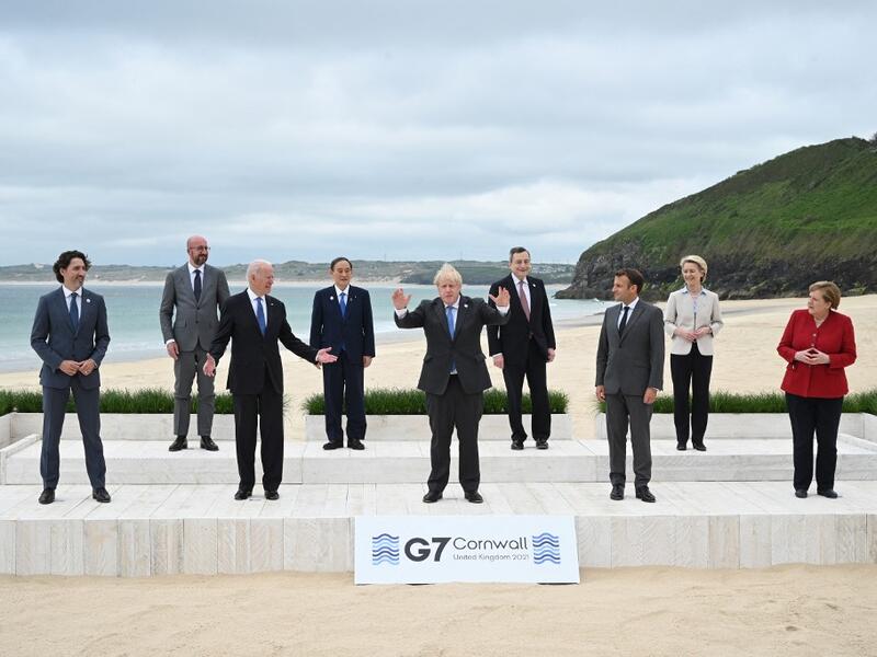 L-R) Canada's Prime Minister Justin Trudeau, President of the European Council Charles Michel, US President Joe Biden, Japan's Prime Minister Yoshihide Suga, Britain's Prime Minister Boris Johnson, Italy's Prime minister Mario Draghi, France's President Emmanuel Macron, President of the European Commission Ursula von der Leyen and Germany's Chancellor Angela Merkel pose for the family photo at the start of the G7 summit in Carbis Bay, Cornwall on June 11, 2021. G7 leaders from Canada, France, Germany, Italy