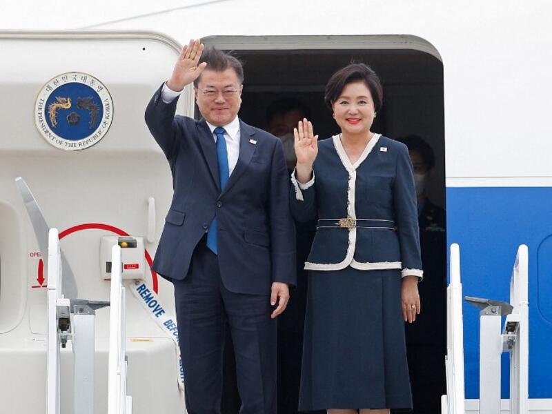South Korea's President Moon Jae-in and South Korea's first lady Kim Jung-sook arrive at Cornwall Airport Newquay, near Newquay, Cornwall, on June 11, 2021 for the G7 summit. 