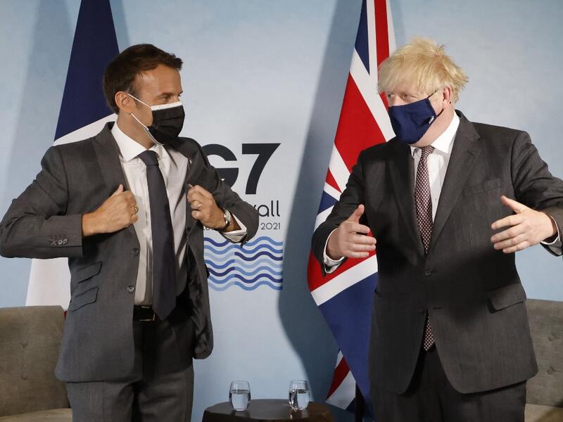Britain's Prime Minister Boris Johnson and France's President Emmanuel Macron take part in a bilateral meeting during the G7 summit in Carbis bay