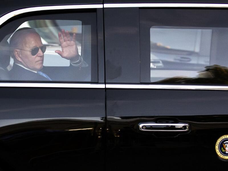 US president Joe Biden waves as he leaves for the airport after his press conference at the end of the US-Russia summit in Geneva 
