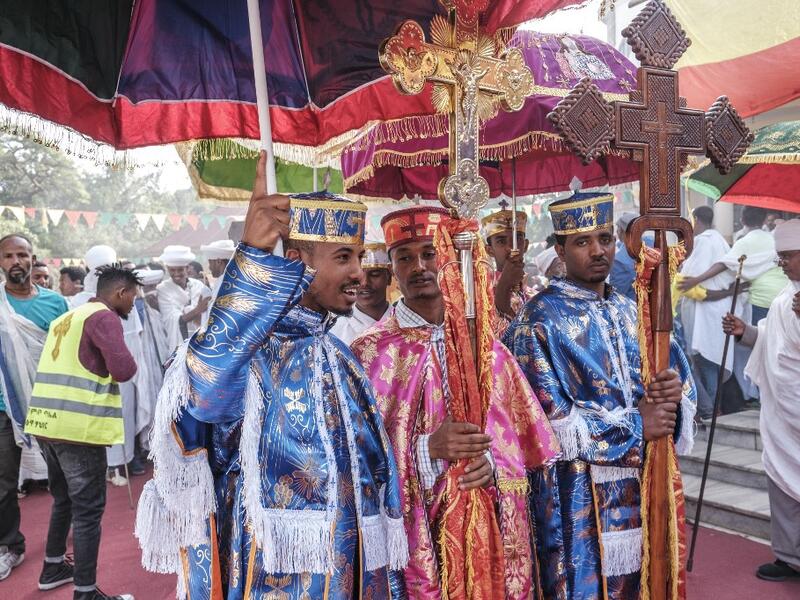 Ethiopian Orthodox deacons hold crosses as they parade during the religious celebration of Saint Michael in the city of Bahir Dar, Ethiopia