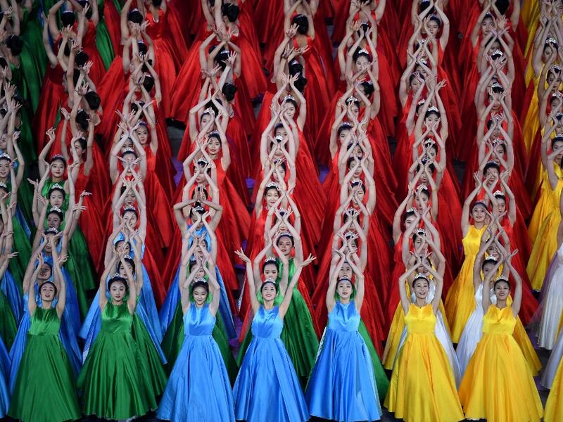 Performers dance as they take part in a Cultural Performance as part of the celebration of the 100th Anniversary of the Founding of the Communist Party of China, at the Bird's nest national stadium in Beijing on June 28, 2021. The 100th anniversary is scheduled 