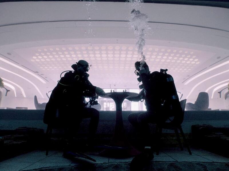 Divers play mock chess while experiencing Deep Dive Dubai, the deepest swimming pool in the world reaching 60m, in the United Arab Emirates, on July 10, 2021. The city of superlatives, with the world's tallest tower among its many records, Dubai now has the deepest swimming pool on the planet complete with a "sunken city" for divers to explore. GIUSEPPE CACACE / AFP