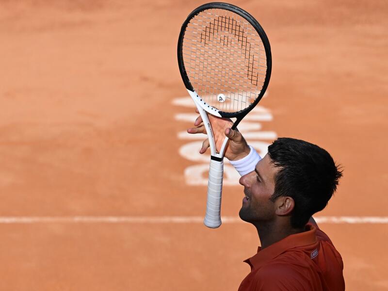 Serbia's Novak Djokovic celebrates after winning the final match of the Men's ATP Rome Open tennis tournament against Greece's Stefanos Tsitsipas on May 15, 2022 at Foro Italico in Rome. (Photo by Tiziana FABI / AFP)