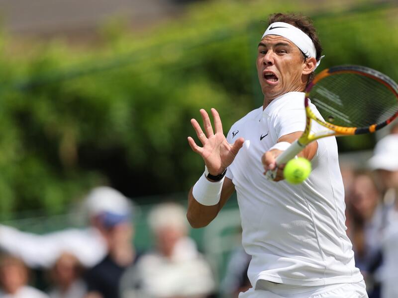 Spain's Rafael Nadal returns to Canada's Felix Auger-Aliassime during their men's exhibition singles match at The Giorgio Armani Tennis Classic tournament at the Hurlingham Club in London on June 24, 2022. (Photo by Adrian DENNIS / AFP)