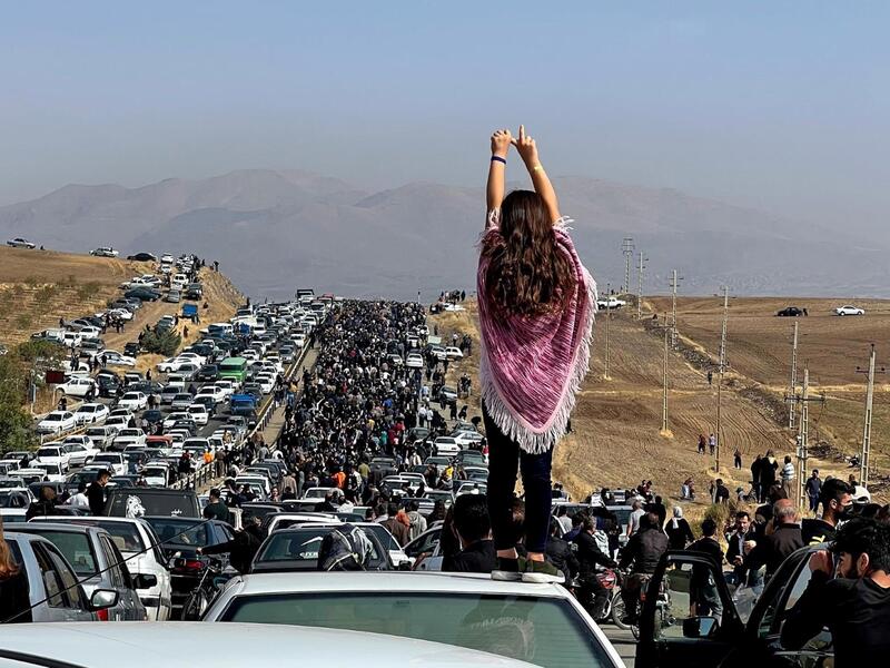 Woman in Iran protests 