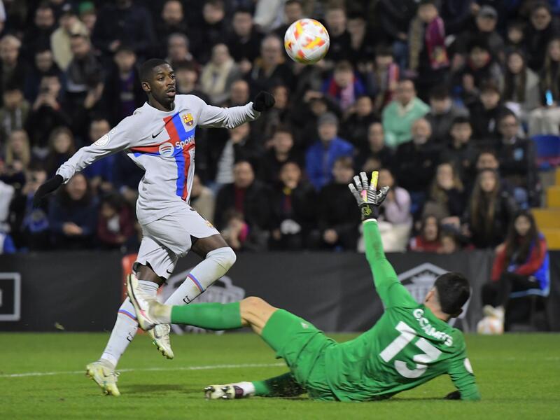 Barcelona's French forward Ousmane Dembele (L) scores his team's second goal during the Spain's Copa del Rey (King's Cup) round of 32, first leg, footbal match between Intercity CF and FC Barcelona at the Jose Rico Perez stadium in Alicante, on January 4, 2023. (Photo by Jose Jordan / AFP)