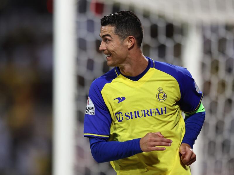 Nassr's Portuguese forward Cristiano Ronaldo celebrates scoring his team's second goal during the Saudi Pro League football match between Al-Wehda and Al-Nassr at the King Abdulaziz Stadium in Mecca on February 9, 2023. (Photo by AFP)