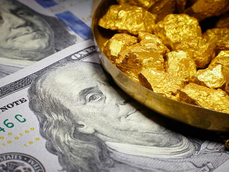 Gold prices rise slightly as the dollar falls