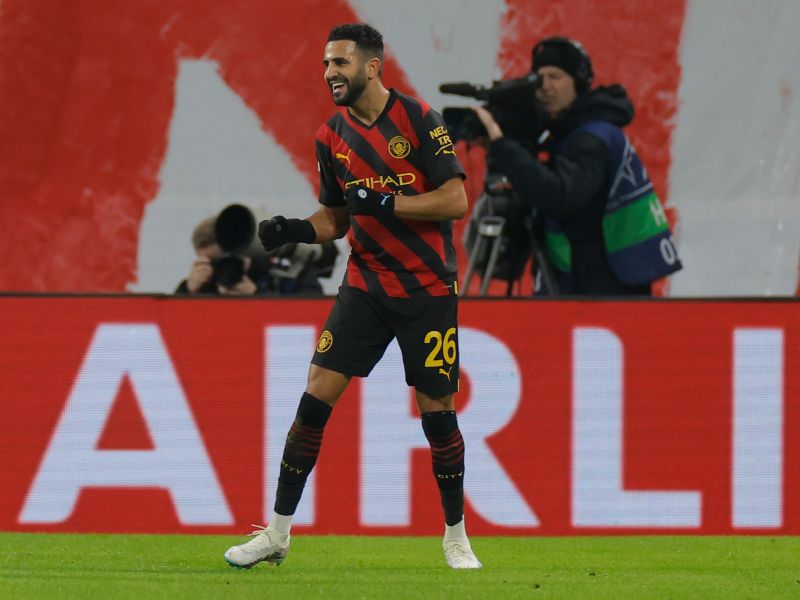 Manchester City's Algerian midfielder Riyad Mahrez celebrates scoring the opening goal during the UEFA Champions League round of 16, first-leg football match between RB Leipzig and Manchester City in Leipzig, eastern Germany on February 22, 2023. (Photo by Odd ANDERSEN / AFP)
