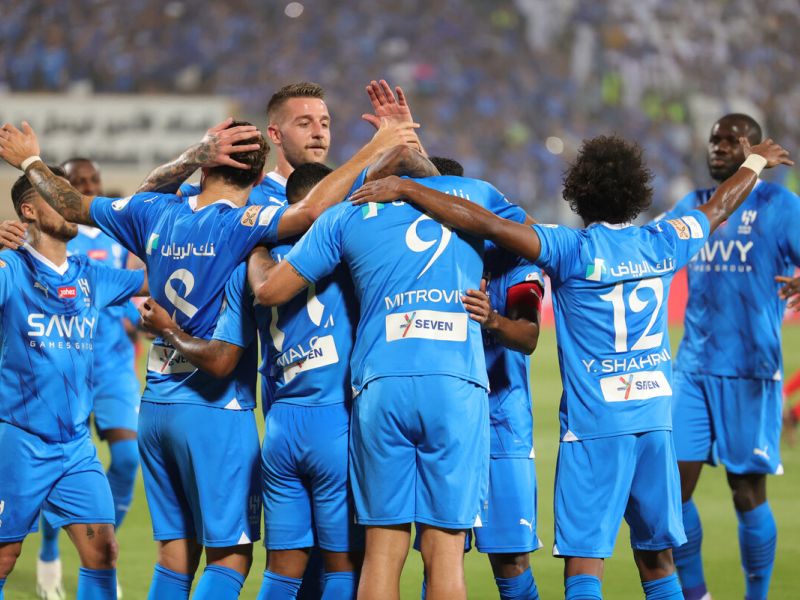 Hilal's players celebrate a goal during the Saudi Pro League football match between Al-Hilal and Al-Riyadh at Prince Faisal Bin Fahd Stadium in Riyadh on September 15, 2023. (Photo by Abdullah Mahdi / AFP)
