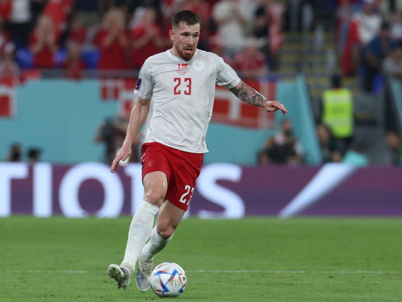 Denmark's midfielder #23 Pierre-Emile Hojbjerg runs with the ball during the Qatar 2022 World Cup Group D football match between France and Denmark at Stadium 974 in Doha on November 26, 2022. (Photo by Giuseppe CACACE / AFP)