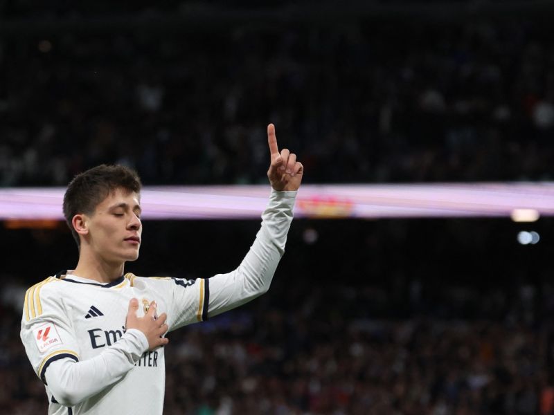 Real Madrid's Turkish midfielder #24 Arda Guler celebrates scoring his team's fourth goal during the Spanish league football match between Real Madrid CF and RC Celta de Vigo at the Santiago Bernabeu stadium in Madrid on March 10, 2024. (Photo by Pierre-Philippe MARCOU / AFP)