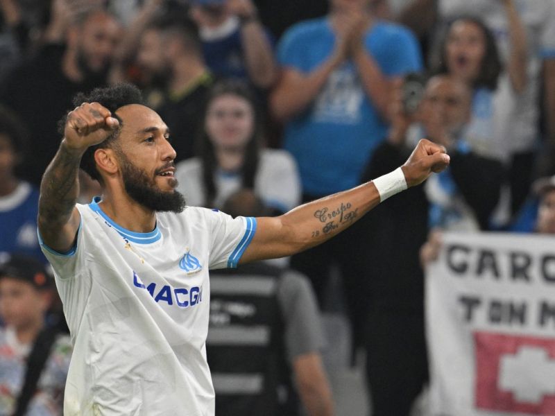 Marseille's French-Gabonese forward #10 Pierre-Emerick Aubameyang celebrates after scoring his team's first goal during the French L1 football match between Olympique Marseille (OM) and FC Lorient at the Stade Velodrome in Marseille, southern France, on May 12, 2024. (Photo by Nicolas TUCAT / AFP)