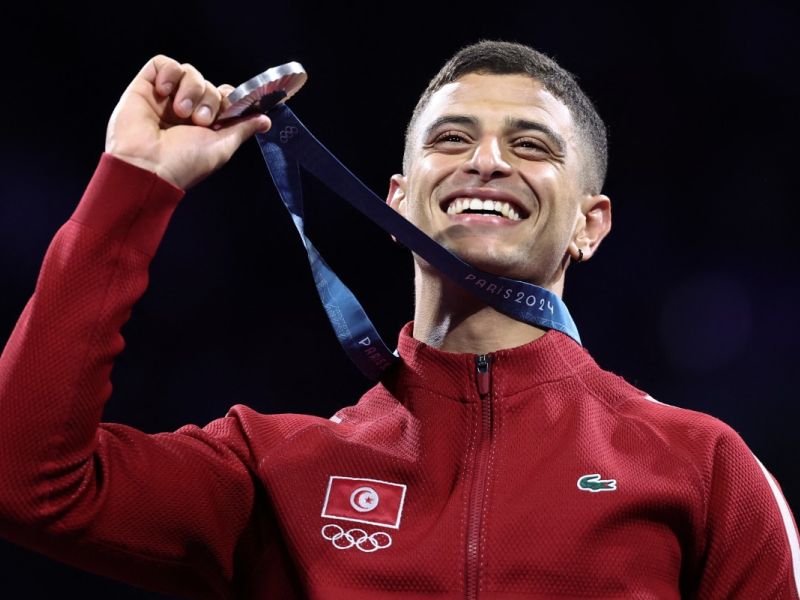 Silver medallist Tunisia's Fares Ferjani celebrates on the podium during the medal ceremony for the men's sabre individual competition during the Paris 2024 Olympic Games at the Grand Palais in Paris, on July 27, 2024. (Photo by Franck FIFE / AFP)