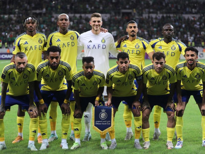 Al-Nassr players pose for a team picture during the AFC Champions League Elite West Region football match between Iraq's Al-Shorta and Saudi Arabia's Al-Nassr at the Al-Madina Stadium in Baghdad's Sadr City on September 16, 2024. (Photo by AHMAD AL-RUBAYE / AFP)