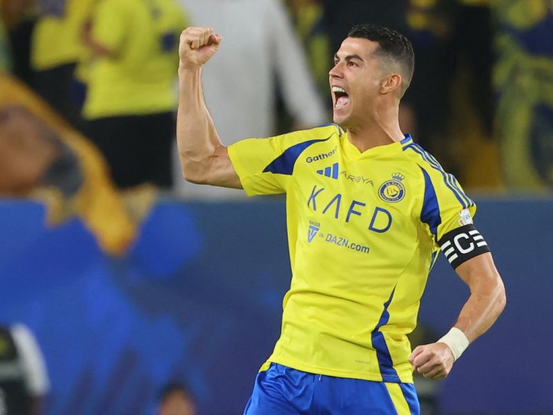 Nassr's Portuguese forward #7 Cristiano Ronaldo celebrates scoring his team's first goal during the Saudi Pro League football match between Al-Nassr and Al-Qadsiah at Al-Awwal Park in Riyadh on November 22, 2024. (Photo by Fayez NURELDINE / AFP)