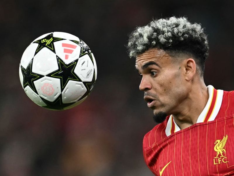 Liverpool's Colombian midfielder #07 Luis Diaz headers the ballduring the UEFA Champions League league stage football match between Liverpool and Bologna at Anfield in Liverpool, north west England on October 2, 2024. (Photo by Paul ELLIS / AFP)