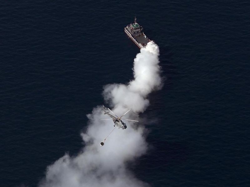 Crew rescued after sanctioned tanker catches fire in suspected attack off Oman