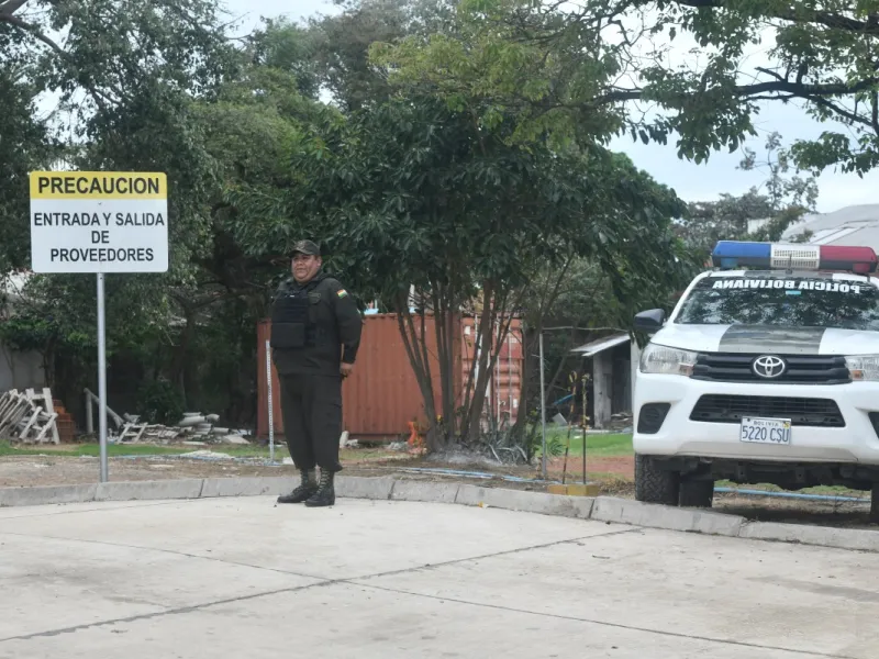 Policeman standing guard outside the hospital where Beller lies.