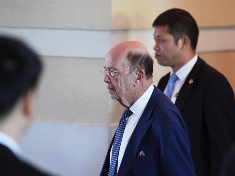 US Commerce Secretary Wilbur Ross (C) walks through a hotel lobby as he heads to the US embassy in Beijing on May 3, 2018. Top US and Chinese officials prepared on May 3 to kick off crucial trade talks in Beijing but both sides sought to dampen expectations for a quick resolution to a heated dispute between the world's two largest economies.
(GREG BAKER / AFP)